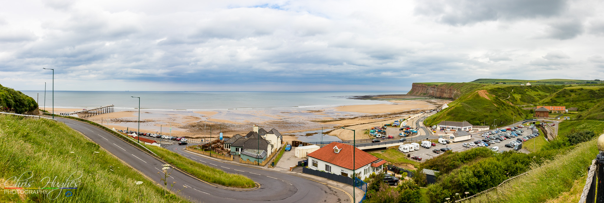 A view over Saltburn-by-the-Sea bay panaorama with tide out